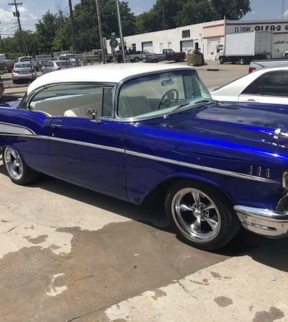 1957 Chevrolet Bel Air, showcasing its classic design and vibrant color, image 1 of 6 in the series.